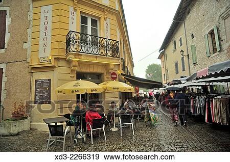 "sidewalk cafe on rainy day, Eymet, Dordogne Department, Aquitaine, France. " View Large Photo Image Stock Photo - "sidewalk cafe on rainy day, Eymet, Dordogne Department, Aquitaine, France. ". Fotosearch