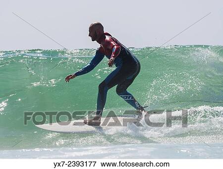 Stock Photo - "Surfer. Tarifa, Cadiz, Costa de la Luz, Andalusia, Spain. ". Fotosearch