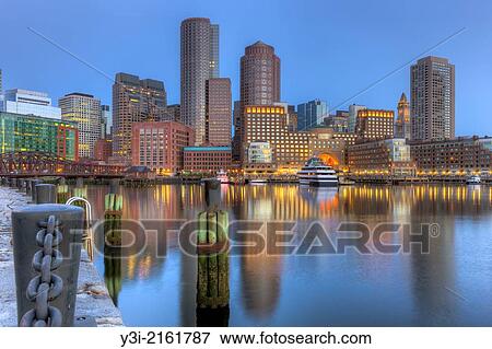 Stock Photo - "The skyline reflects off the still waters of the harbor in the last hour before sunrise as a new day begins in Boston, Massachusetts, USA. ". Fotosearch
