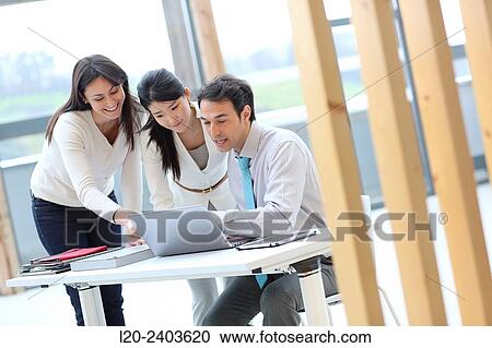 Three executives looking at computer View Large Photo Image Stock Image - Three executives looking at computer. Fotosearch
