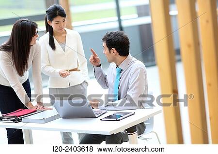 Stock Photo - Three executives talking. Fotosearch