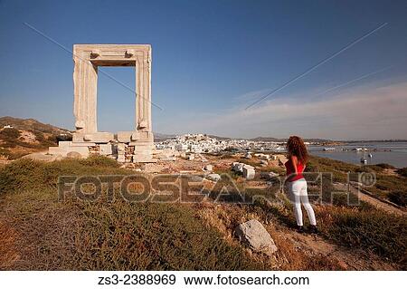 Stock Photo - "Tourist at the famous Portara door in town center, Naxos, Cyclades Islands, Greek Islands, Greece, Europe. ". Fotosearch