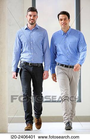 Stock Image - Two executives walking. Fotosearch