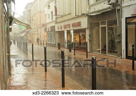 Stock Image - "Villeneuve-sur-Lot during rain storm, Lot-et-Garonne Department, Aquitaine, France. ". Fotosearch
