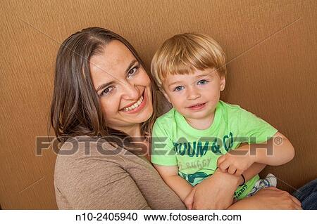 Stock Image - Woman with her young son.. Fotosearch