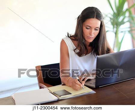 Woman working with laptop View Large Photo Image Picture - Woman working with laptop. Fotosearch
