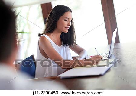 Stock Image - Woman working with laptop. Fotosearch