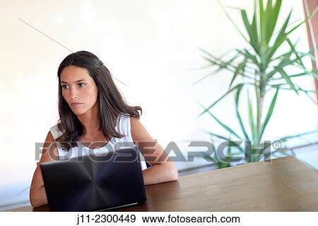 Woman working with laptop View Large Photo Image Stock Photo - Woman working with laptop. Fotosearch