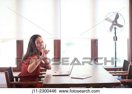 Stock Photograph - Woman working with laptop. Fotosearch
