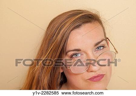 Stock Photography - Young woman wearing glasses.. Fotosearch