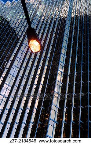 A street light shines against the backdrop of a modern skyscraper, Toronto, Ontario, Canada View Large Photo Image Stock Photograph - A street light shines against the backdrop of a modern skyscraper, Toronto, Ontario, Canada. Fotosearch