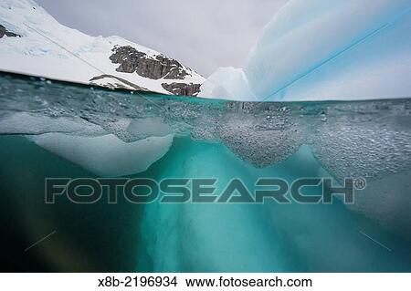 Above and below view of glacial ice, Cuverville Island, Errera Channel, Antarctica. View Large Photo Image Picture - Above and below view of glacial ice, Cuverville Island, Errera Channel, Antarctica.. Fotosearch