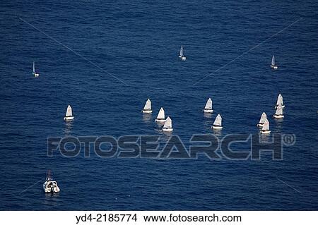 Aerial view of a boat race in the notrh of the island, Mallorca, Balearic Island, Spain. View Large Photo Image Picture - Aerial view of a boat race in the notrh of the island, Mallorca, Balearic Island, Spain.. Fotosearch