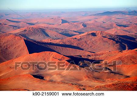 Aerial view of the red sand dunes of Sossusvlei, Namib-Naukluft Park, Namibia, Africa. View Large Photo Image Stock Image - Aerial view of the red sand dunes of Sossusvlei, Namib-Naukluft Park, Namibia, Africa.. Fotosearch