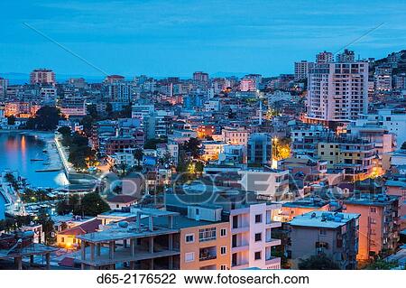 Albania, Albanian Riviera, Saranda, elevated city view, dawn. View Large Photo Image Stock Image - Albania, Albanian Riviera, Saranda, elevated city view, dawn.. Fotosearch