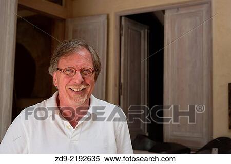 An older man enjoys the pleasure of pursuing craft activities. View Large Photo Image Stock Photography - An older man enjoys the pleasure of pursuing craft activities.. Fotosearch