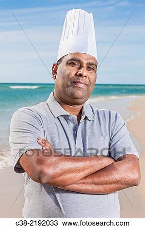 Stock Image - Asian catering chefs at the beach cooking with a Koththu station. Gold Coast, Queensland, Australia.. Fotosearch