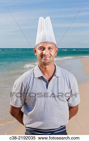 Stock Photography - Asian catering chefs at the beach cooking with a Koththu station. Gold Coast, Queensland, Australia.. Fotosearch