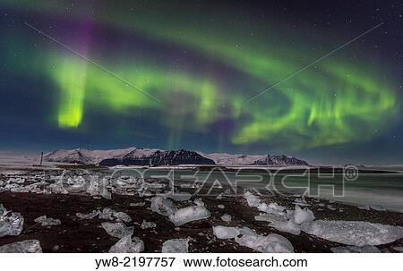 Aurora Borealis and Icebergs on the black sands, Breidamerkursandur, Vatnajokull Ice Cap, Iceland. View Large Photo Image Stock Photo - Aurora Borealis and Icebergs on the black sands, Breidamerkursandur, Vatnajokull Ice Cap, Iceland.. Fotosearch