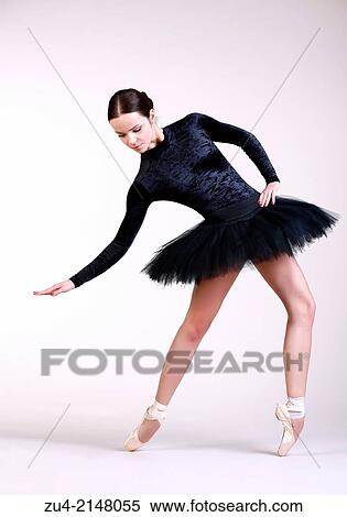 Ballerina posing in black tutu View Large Photo Image Stock Photography - Ballerina posing in black tutu. Fotosearch