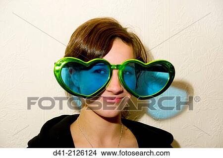 Picture - Blue coloured heart shaped spectacles.. Fotosearch