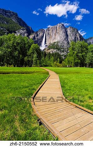 Boardwalk through meadow under Yosemite Falls, Yosemite National Park, California USA. View Large Photo Image Stock Image - Boardwalk through meadow under Yosemite Falls, Yosemite National Park, California USA.. Fotosearch