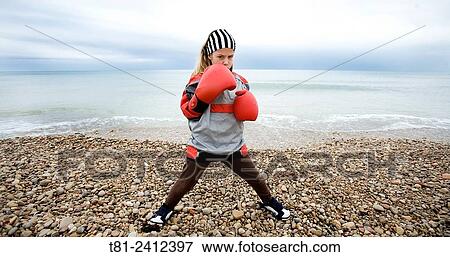 Boxer girl training on the beach, Spain View Large Photo Image Stock Photo - Boxer girl training on the beach, Spain. Fotosearch