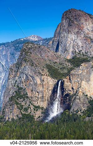 Bridal Veil Falls and mountain range as seen from Tunnel View in the Yosemite National Park, California, USA View Large Photo Image Stock Photograph - Bridal Veil Falls and mountain range as seen from Tunnel View in the Yosemite National Park, California, USA. Fotosearch
