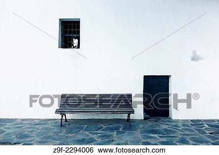 Stock Photograph - Cat in window, bench & door. Cadaques, Catalonia, Costa Brava, Girona, Spain. Fotosearch