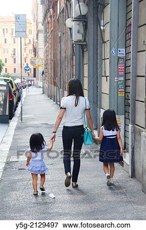 Stock Photo - chinese mother and children in the esquilino district of rome italy. Fotosearch