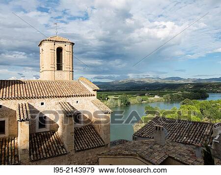 Church of Miravet perched over the Ebro river, Spain. View Large Photo Image Stock Photo - Church of Miravet perched over the Ebro river, Spain.. Fotosearch