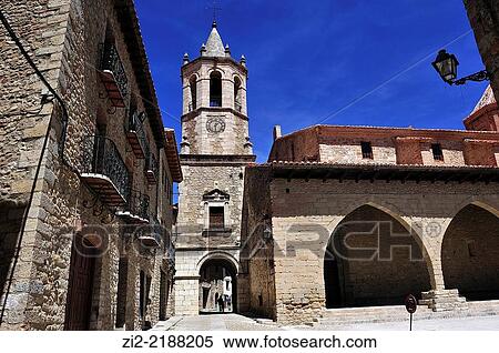 Stock Photography - Church of the Assumption, XVIIIth century and arcades of Main Square. Cantavieja, Teruel, Spain. Fotosearch