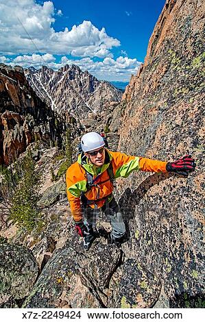 climbing the Chockstone Couloir, AKA the Boy Scout Couloir an alpine route which is rated Grade 3, Class 4 and located on The Grand Mogul in the Sawtooth Mountains in central Idaho. View Large Photo Image Picture - climbing the Chockstone Couloir, AKA the Boy Scout Couloir an alpine route which is rated Grade 3, Class 4 and located on The Grand Mogul in the Sawtooth Mountains in central Idaho.. Fotosearch