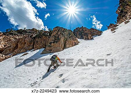 climbing the Chockstone Couloir, AKA the Boy Scout Couloir an alpine route which is rated Grade 3, Class 4 and located on The Grand Mogul in the Sawtooth Mountains in central Idaho. View Large Photo Image Stock Image - climbing the Chockstone Couloir, AKA the Boy Scout Couloir an alpine route which is rated Grade 3, Class 4 and located on The Grand Mogul in the Sawtooth Mountains in central Idaho.. Fotosearch