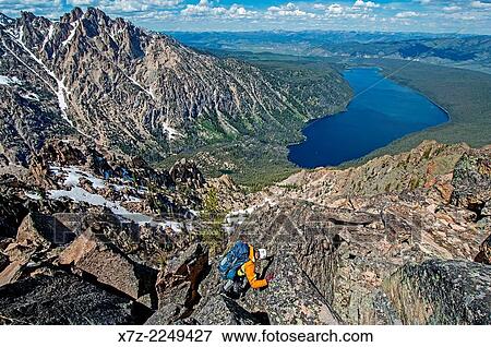 climbing the Chockstone Couloir, AKA the Boy Scout Couloir an alpine route which is rated Grade 3, Class 4 and located on The Grand Mogul in the Sawtooth Mountains in central Idaho. View Large Photo Image Stock Photo - climbing the Chockstone Couloir, AKA the Boy Scout Couloir an alpine route which is rated Grade 3, Class 4 and located on The Grand Mogul in the Sawtooth Mountains in central Idaho.. Fotosearch