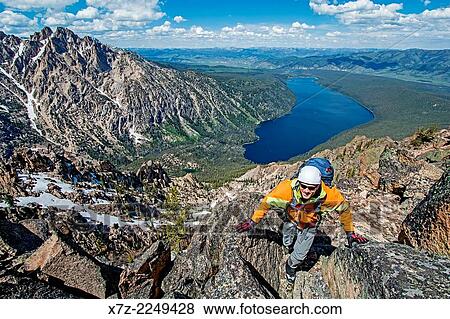 climbing the Chockstone Couloir, AKA the Boy Scout Couloir an alpine route which is rated Grade 3, Class 4 and located on The Grand Mogul in the Sawtooth Mountains in central Idaho. View Large Photo Image Stock Photo - climbing the Chockstone Couloir, AKA the Boy Scout Couloir an alpine route which is rated Grade 3, Class 4 and located on The Grand Mogul in the Sawtooth Mountains in central Idaho.. Fotosearch