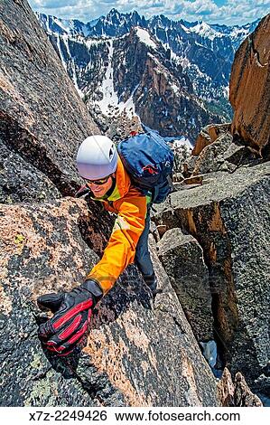 climbing the Chockstone Couloir, AKA the Boy Scout Couloir an alpine route which is rated Grade 3, Class 4 and located on The Grand Mogul in the Sawtooth Mountains in central Idaho. View Large Photo Image Stock Photograph - climbing the Chockstone Couloir, AKA the Boy Scout Couloir an alpine route which is rated Grade 3, Class 4 and located on The Grand Mogul in the Sawtooth Mountains in central Idaho.. Fotosearch