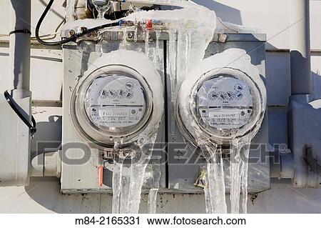 Close-up of ice covered hydro electricity consumption meters on the exterior wall of a residential home in winter, Quebec, Canada. View Large Photo Image Stock Image - Close-up of ice covered hydro electricity consumption meters on the exterior wall of a residential home in winter, Quebec, Canada.. Fotosearch