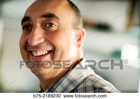 Close-up of the face of a 40-year-old Caucasian man, smiling and with positive attitude. View Large Photo Image Stock Image - Close-up of the face of a 40-year-old Caucasian man, smiling and with positive attitude.. Fotosearch