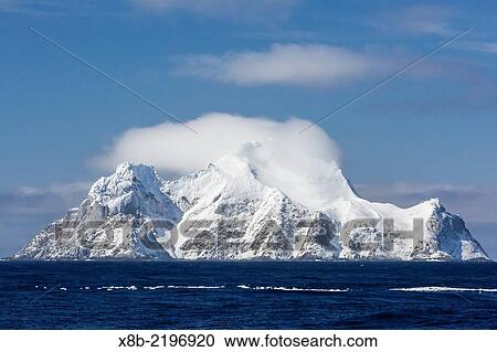 Clouds forming over Clarence Island as seen from Elephant Island, South Shetland Islands, Antarctica. View Large Photo Image Stock Image - Clouds forming over Clarence Island as seen from Elephant Island, South Shetland Islands, Antarctica.. Fotosearch