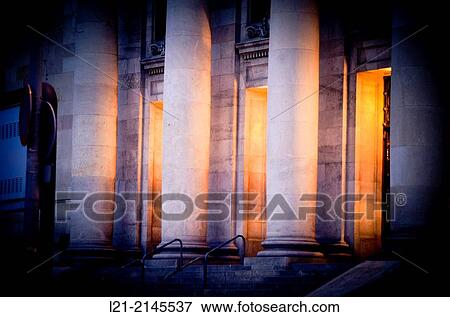 Columns and interior light at dusk, night. View of central post office building designed by Josep Goday Casals and Jaume Torres Grau. Barcelona, Catalonia, Spain. View Large Photo Image Stock Photo - Columns and interior light at dusk, night. View of central post office building designed by Josep Goday Casals and Jaume Torres Grau. Barcelona, Catalonia, Spain.. Fotosearch
