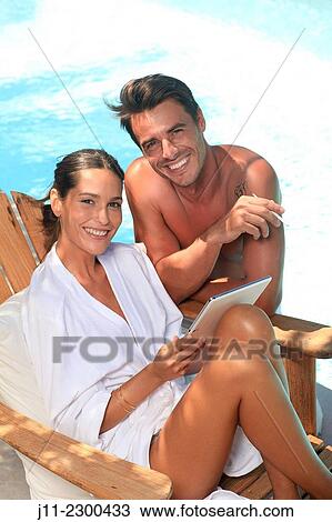 Couple by the pool View Large Photo Image Stock Image - Couple by the pool. Fotosearch
