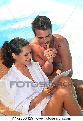 Couple by the pool View Large Photo Image Stock Photo - Couple by the pool. Fotosearch