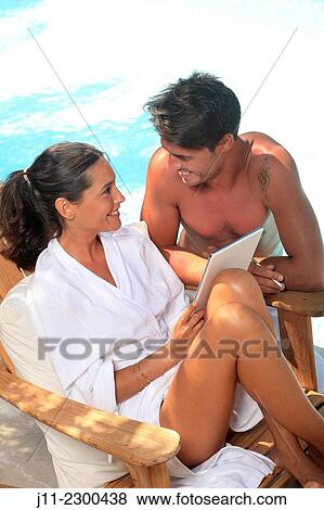 Couple by the pool View Large Photo Image Stock Photo - Couple by the pool. Fotosearch