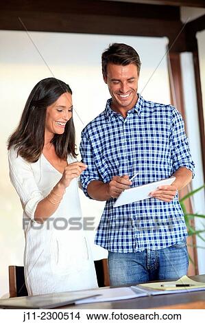Couple with digital tablet View Large Photo Image Picture - Couple with digital tablet. Fotosearch