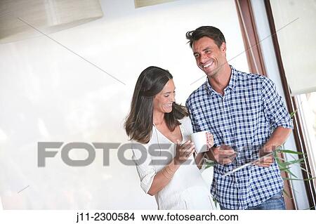 Couple with digital tablet View Large Photo Image Picture - Couple with digital tablet. Fotosearch