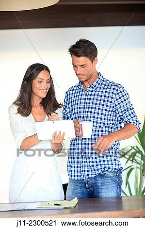 Couple with digital tablet View Large Photo Image Stock Image - Couple with digital tablet. Fotosearch