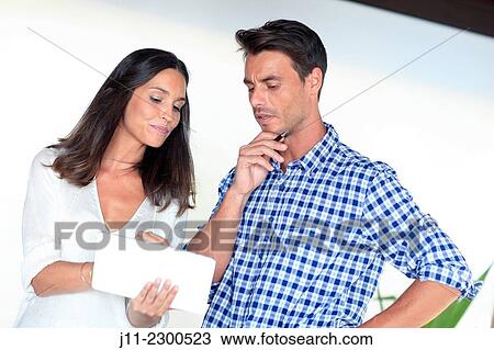 Couple with digital tablet View Large Photo Image Stock Image - Couple with digital tablet. Fotosearch