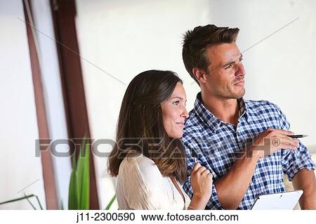 Couple with digital tablet View Large Photo Image Stock Image - Couple with digital tablet. Fotosearch