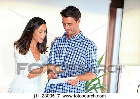 Couple with digital tablet View Large Photo Image Stock Photo - Couple with digital tablet. Fotosearch